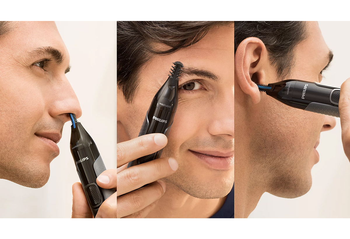 Ένας άντρας τριμμάρει τη μύτη, τα φρύδια και τα αυτιά του.